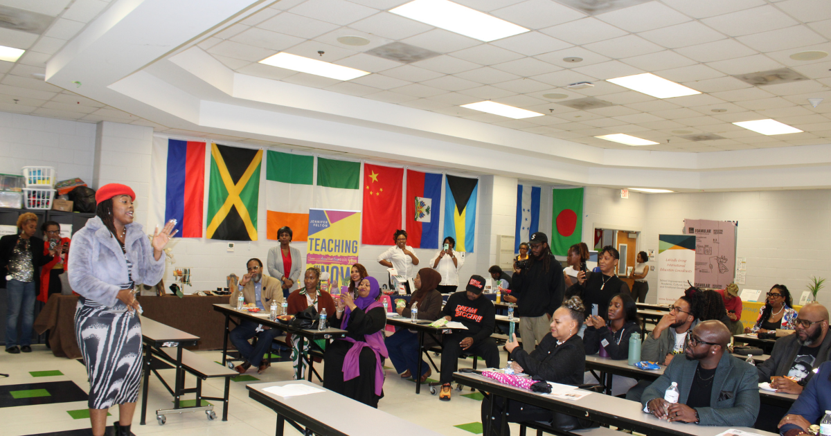 Educator presenting to a room full of engaged conference attendees